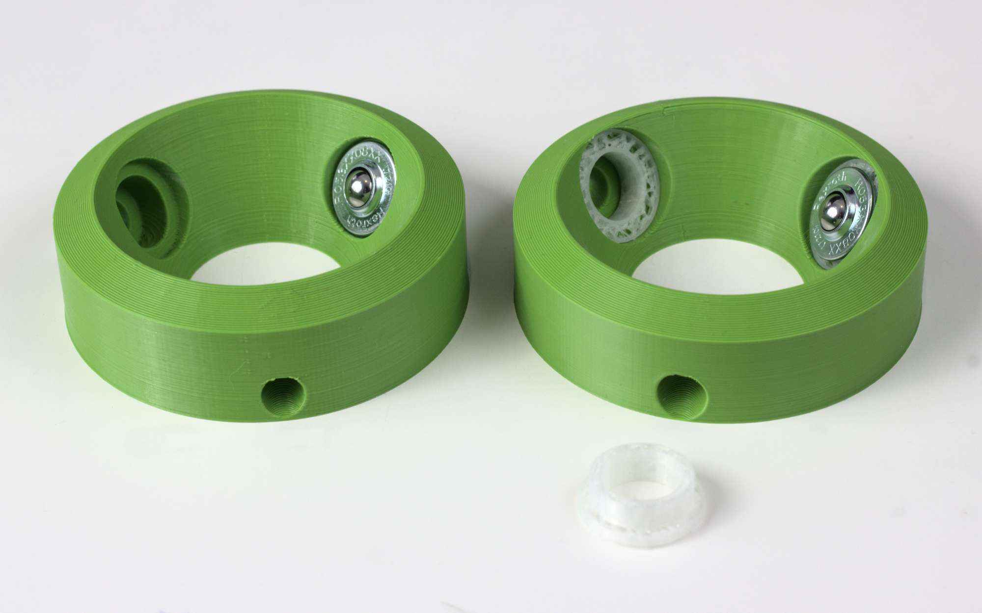 The two BTU testers Two BTU testers, each a ring with 3 holes for BTUs. The right-hand one has some extra white rubbery pieces to hold the BTUs.