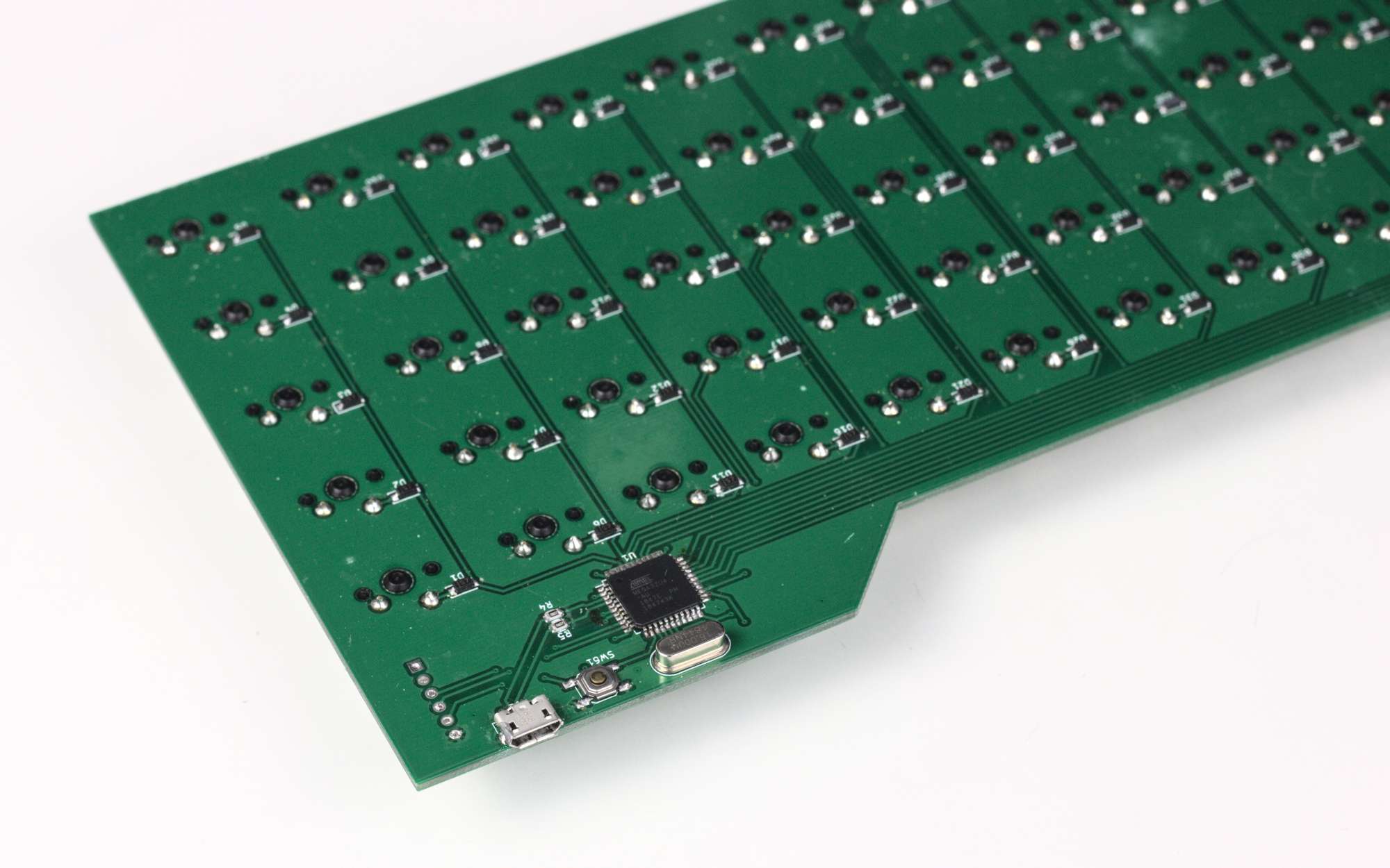 A keyboard PCB? The corner of a keyboard PCB, showing the microcontroller