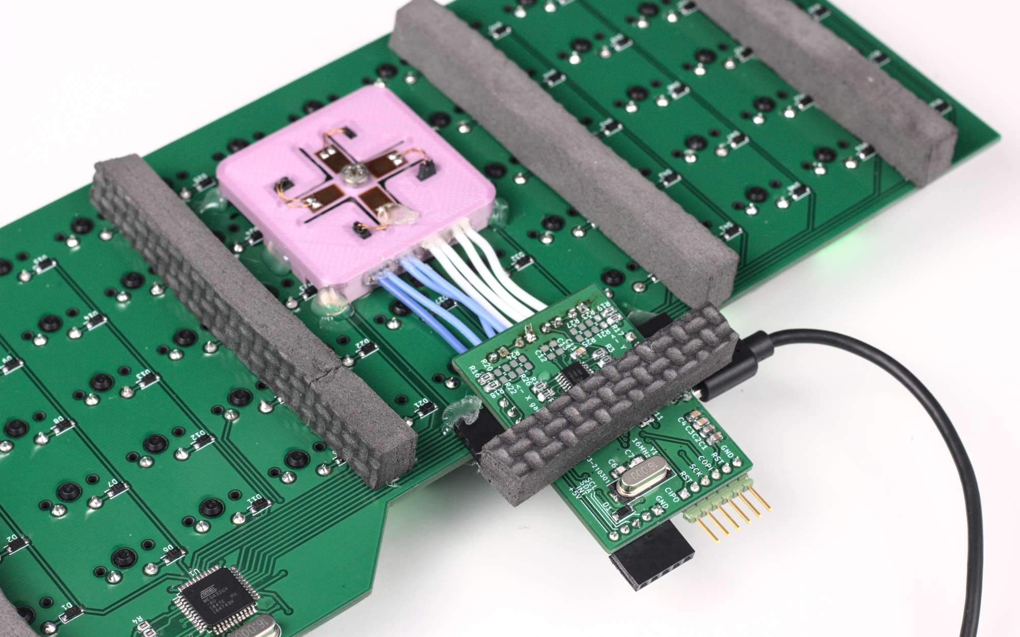 Closer view of the trackpoint PCB and mount Close-up of trackpoint underside