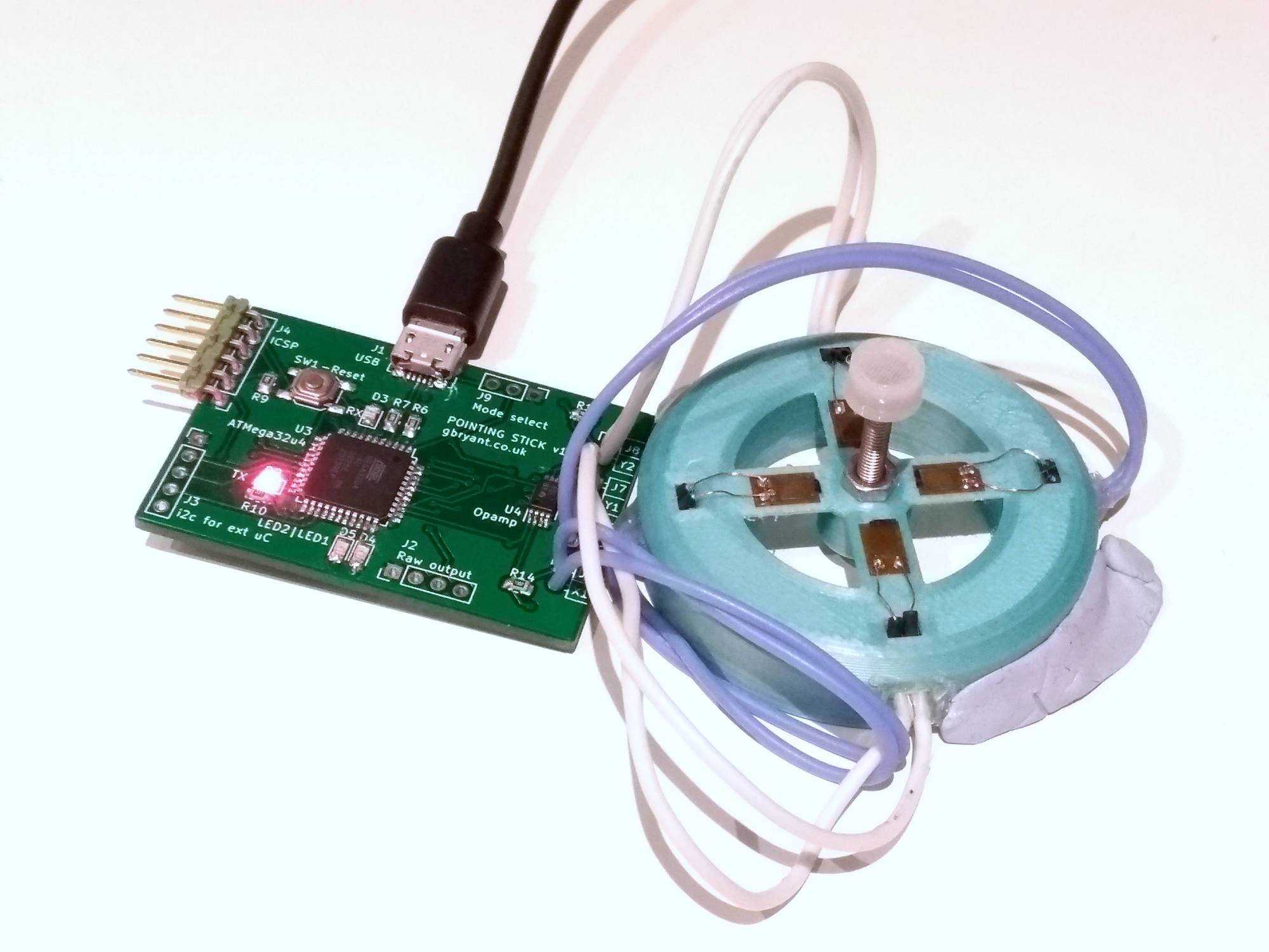 Pointing stick PCB wired up to a pointing stick prototype. Much neater than the breadboard!